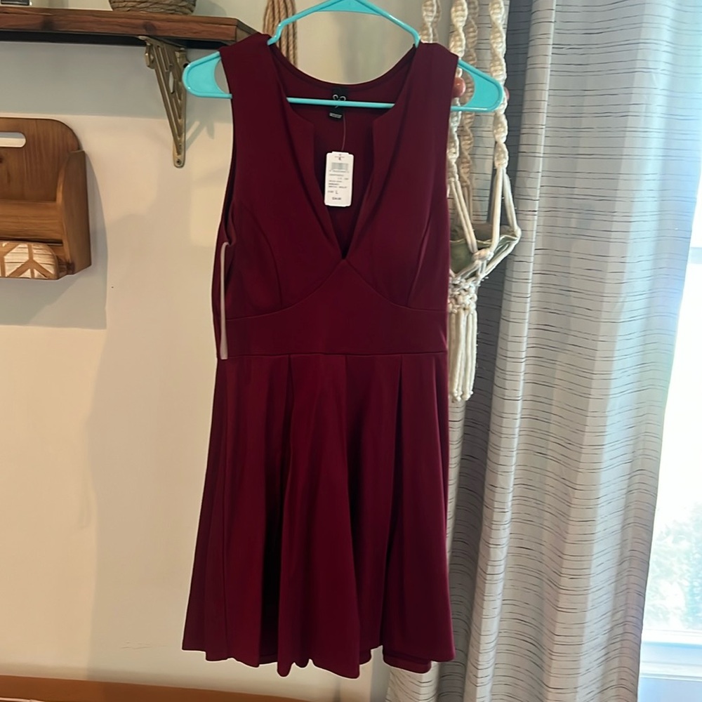 Formal at the knee dress with v cut. NWT
